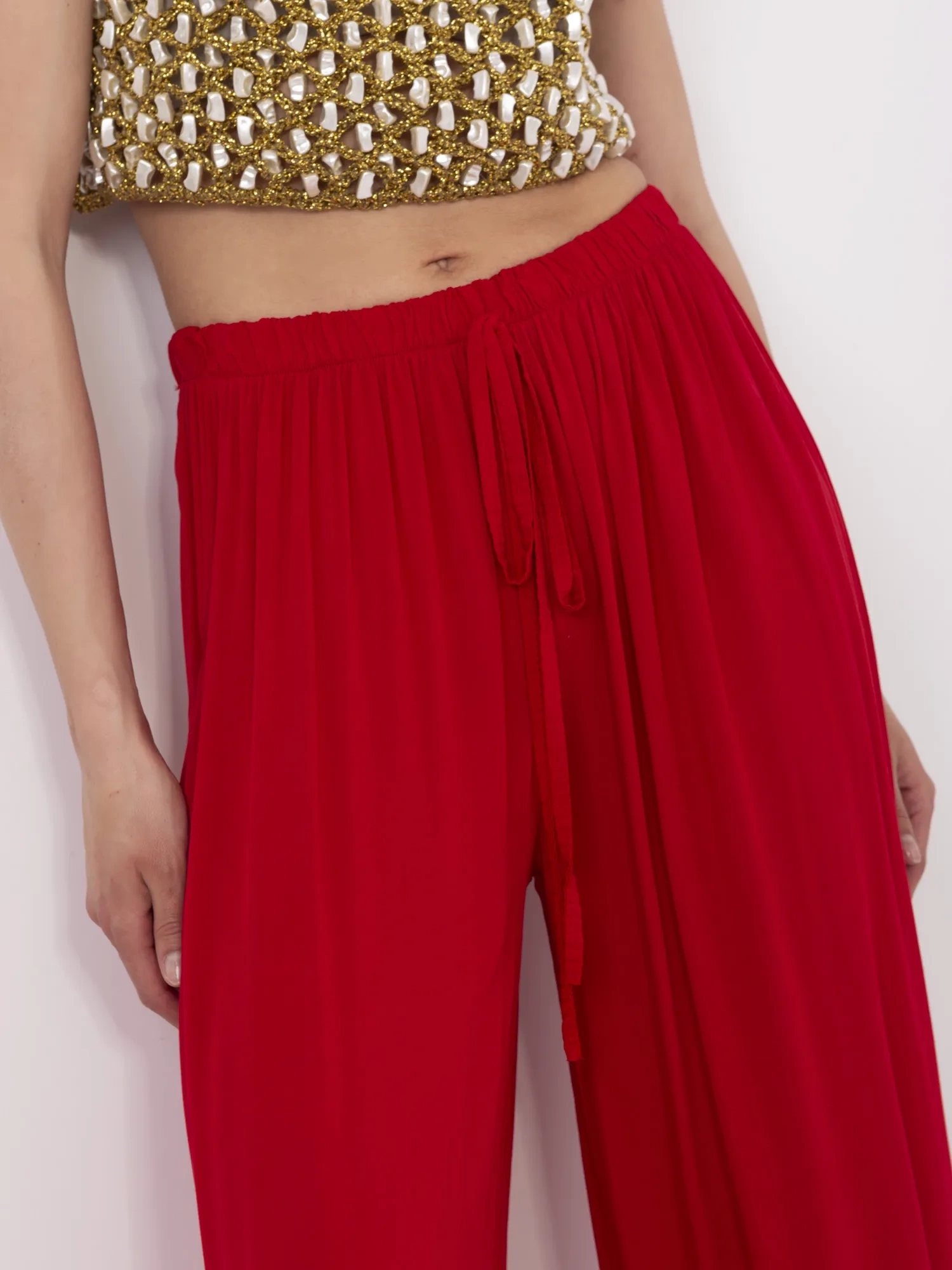 Red wide pleated pants.
