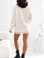Light beige oversized sweater with lace trim.