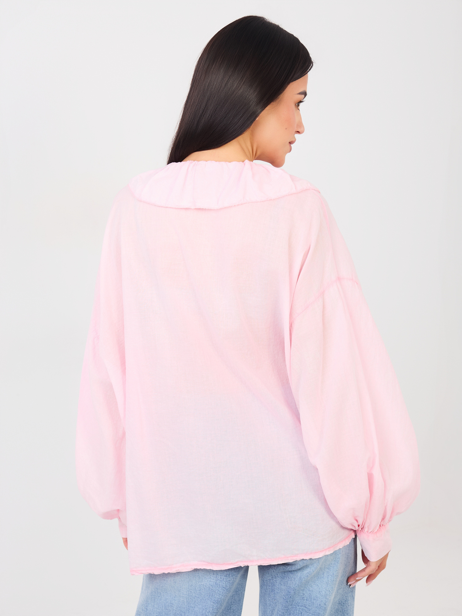 Light pink women's blouse with puffed sleeves.