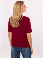 Burgundy women's sweater with braids.