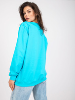 Modra-bela oversize bluza brez kapuce z žepi.