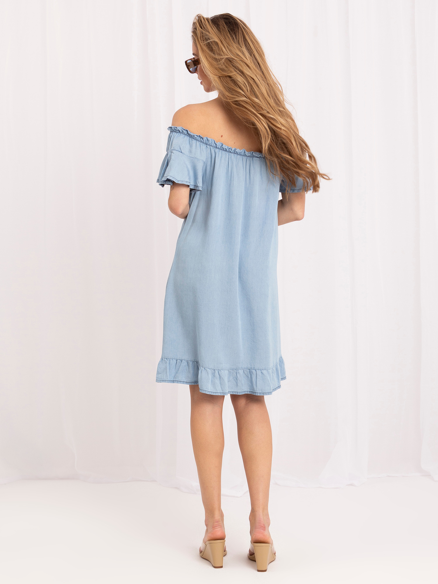 Light blue off-the-shoulder dress with ruffles.