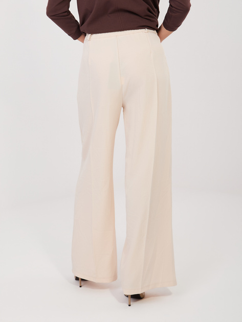 Jasnobeżowe garniturowe spodnie z zakładkami RUE PARIS
