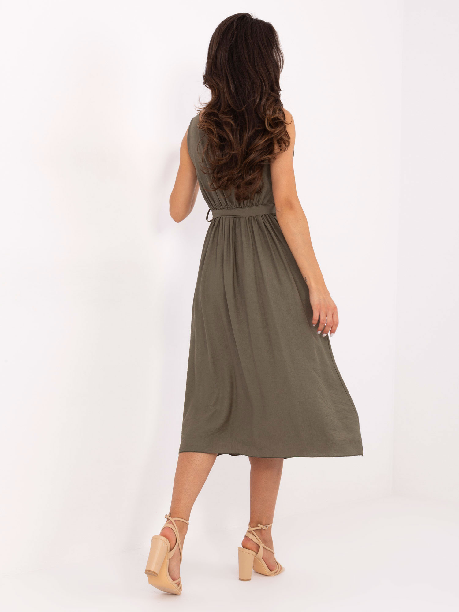 Khaki summer dress with a tied belt.