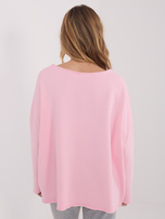 Light pink oversized sweatshirt with a round neckline.