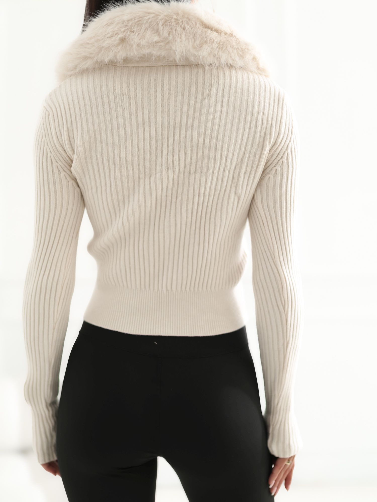 Light beige striped zip-up sweater.