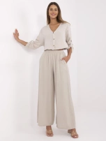 Beżowe muślinowe spodnie z szeroką nogawką