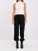 Black corduroy pants with side pockets.