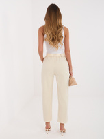 Jasnobeżowe sztruksowe spodnie typu carrot