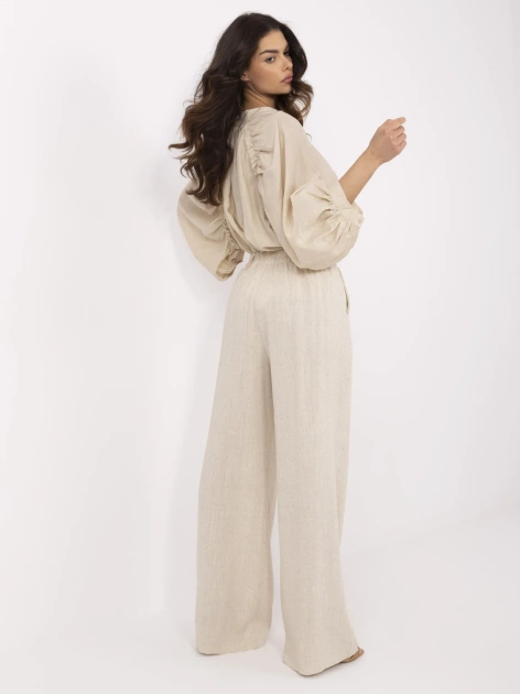 Beżowe letnie spodnie z szeroką nogawką