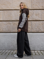 Chocolate kangaroo hoodie with decorative sleeves.