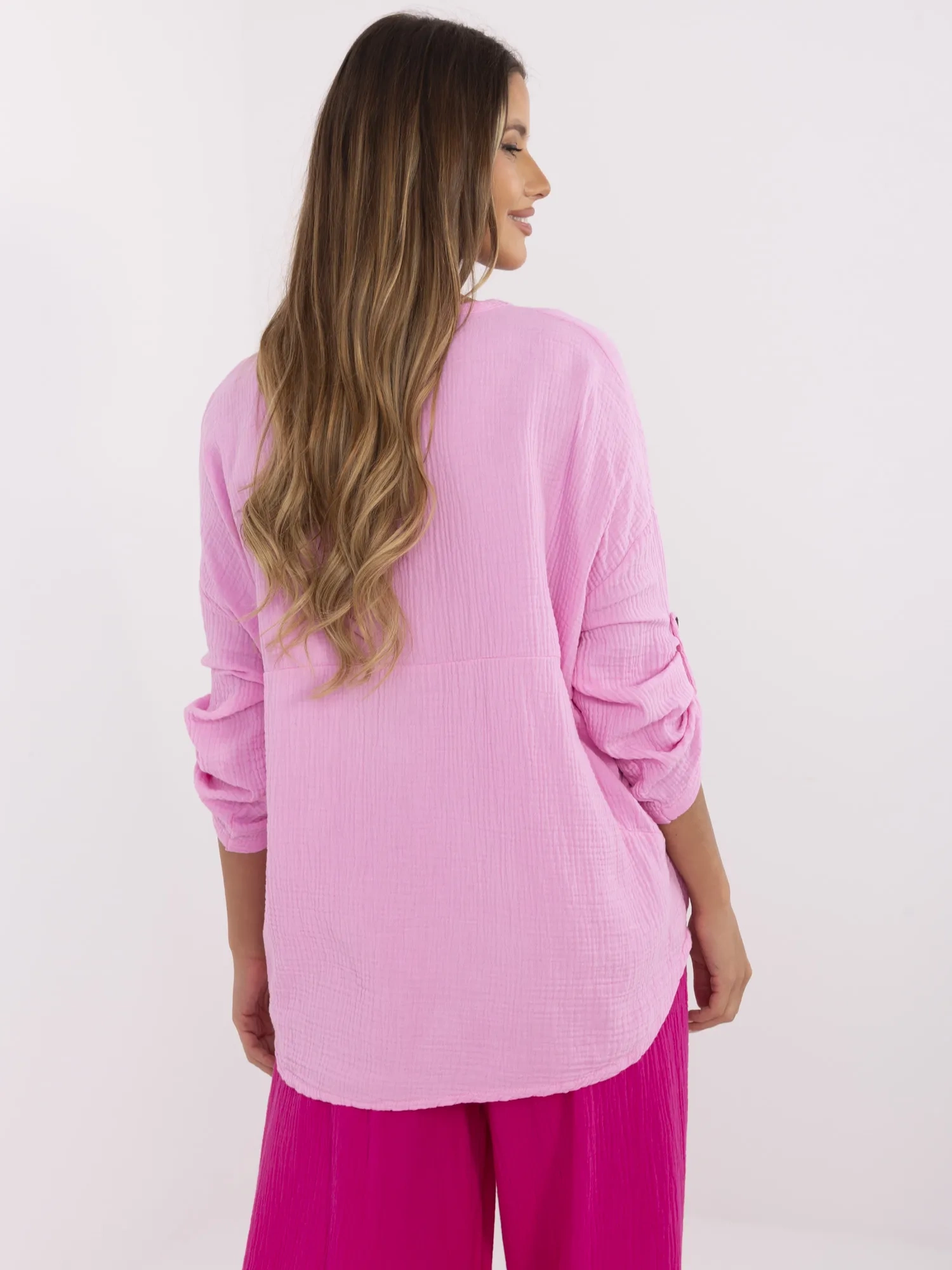 Pink muslin women's shirt with 3/4 sleeves.