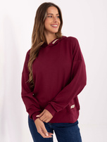 Burgundy women's sweatshirt with patches.