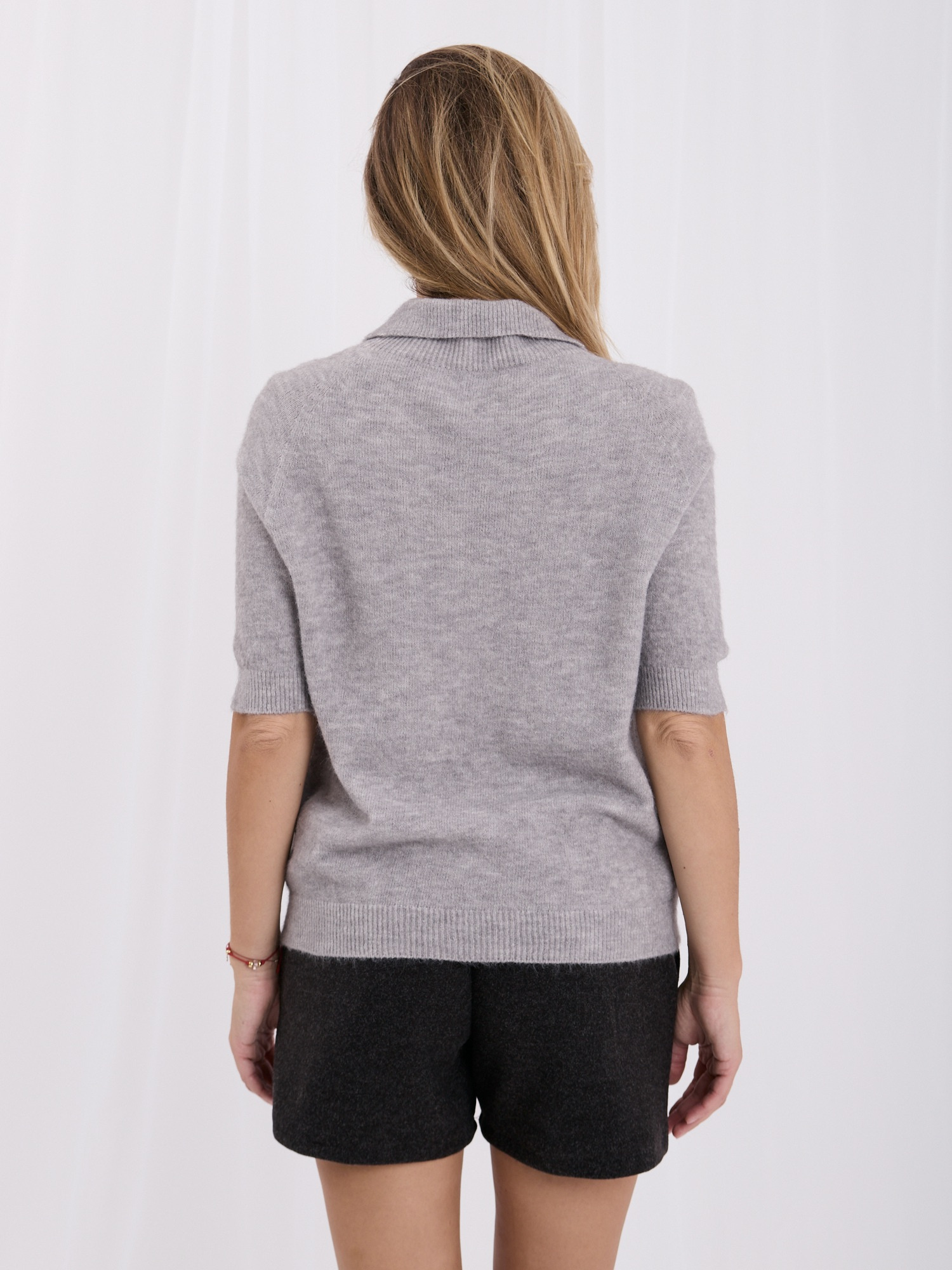 Gray women's polo sweater with a mohair effect.