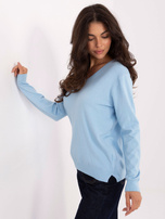 Light blue basic sweater with long sleeves.