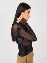 Black mesh blouse with long sleeves.