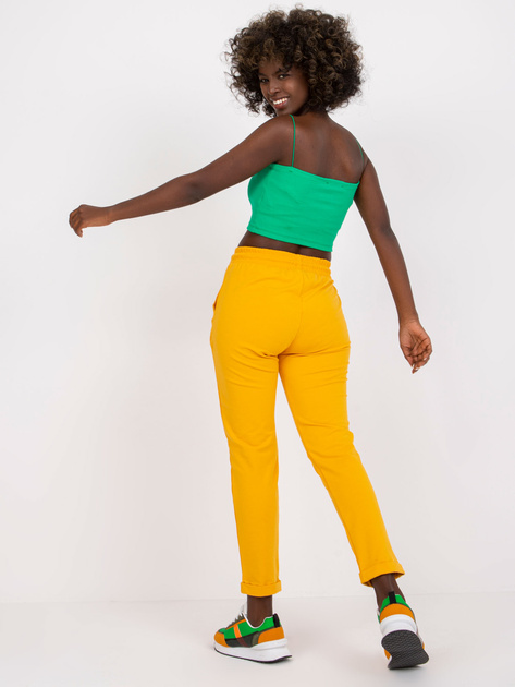 Jasnopomarańczowe spodnie dresowe basic z kieszeniami