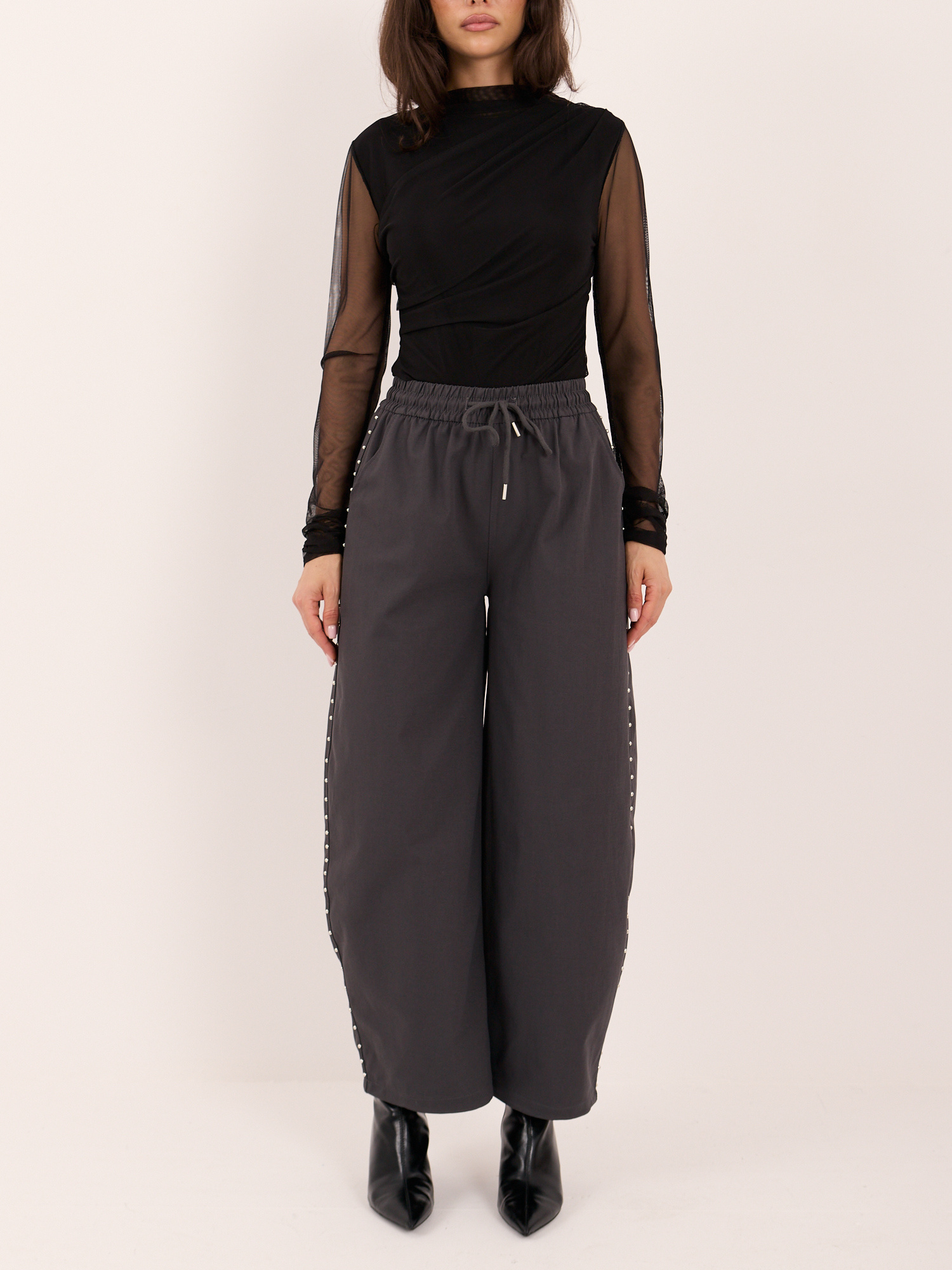 Graphite balloon pants with metal studs.