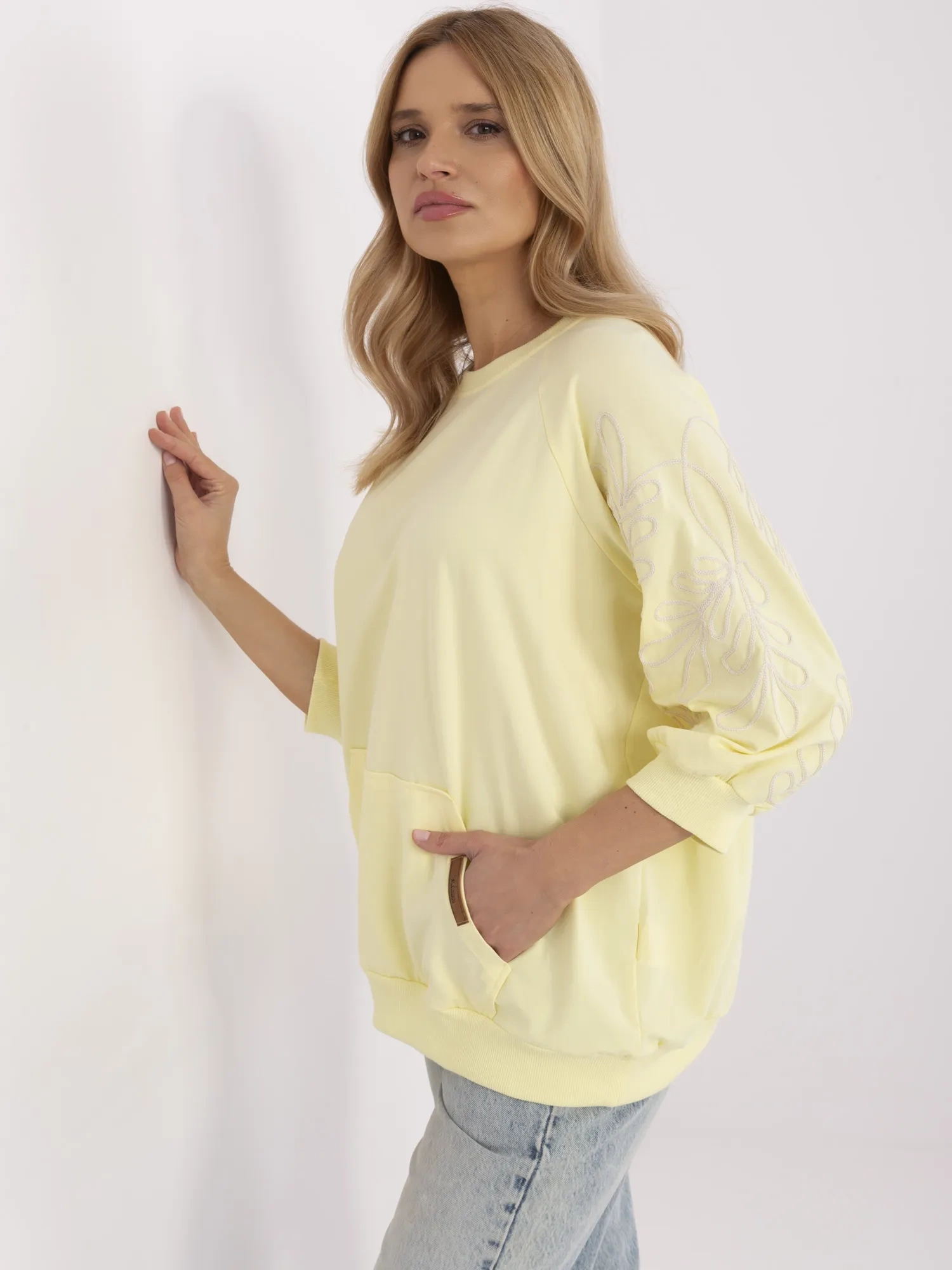 Light yellow women's kangaroo hoodie with 3/4 sleeves.