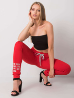 Czerwone spodnie dresowe z napisem Fatemah