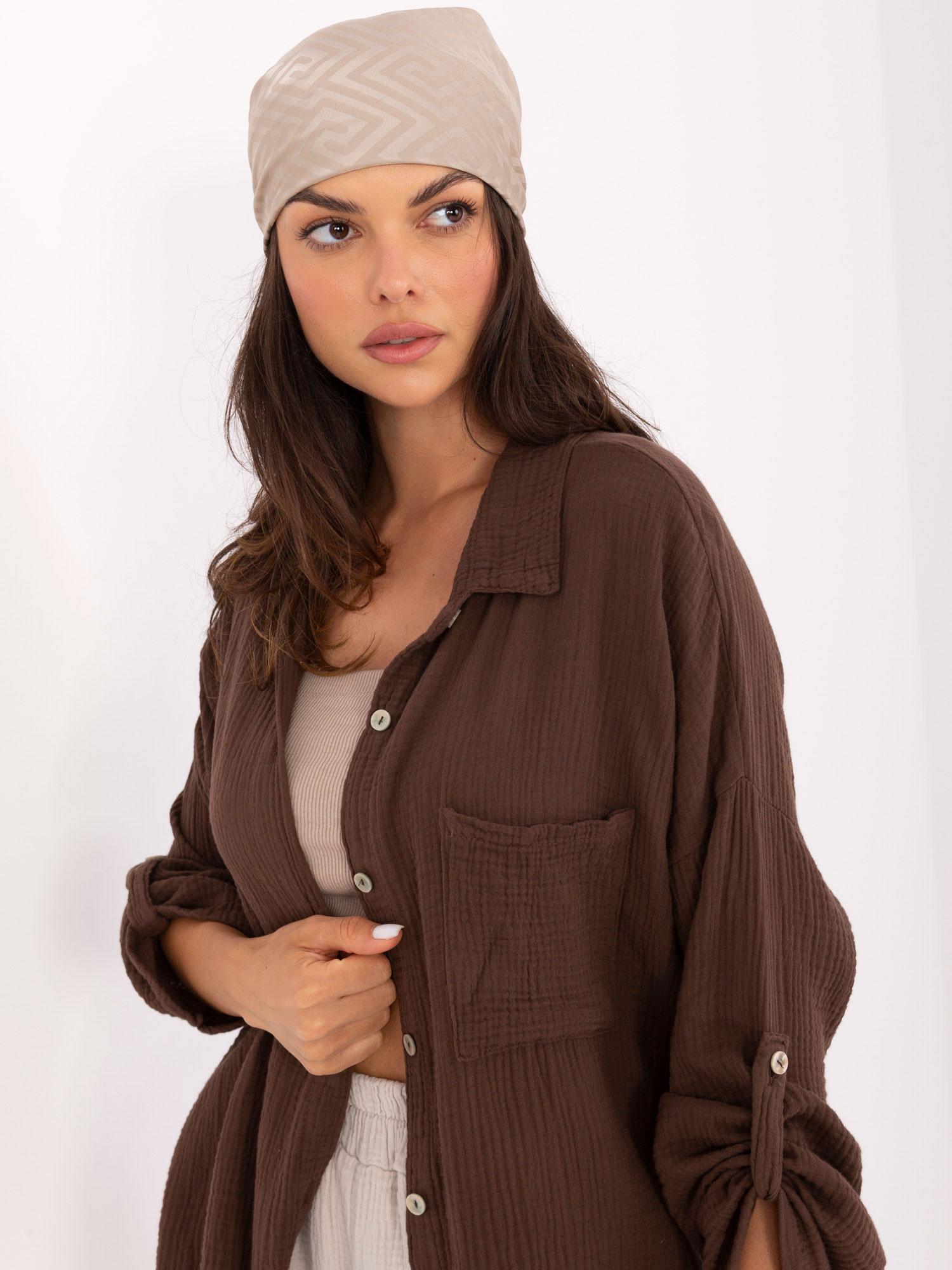 Dark brown oversized muslin shirt.