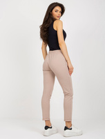 Hurt Beżowe damskie spodnie dresowe z kieszeniami