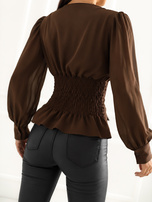 Brown corset blouse with puff sleeves.