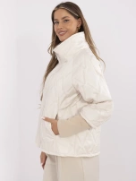 Light beige quilted jacket without a hood.