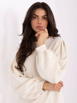 Light beige sweatshirt with puff sleeves.