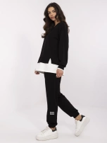 Black tracksuit set with a hoodless sweatshirt.