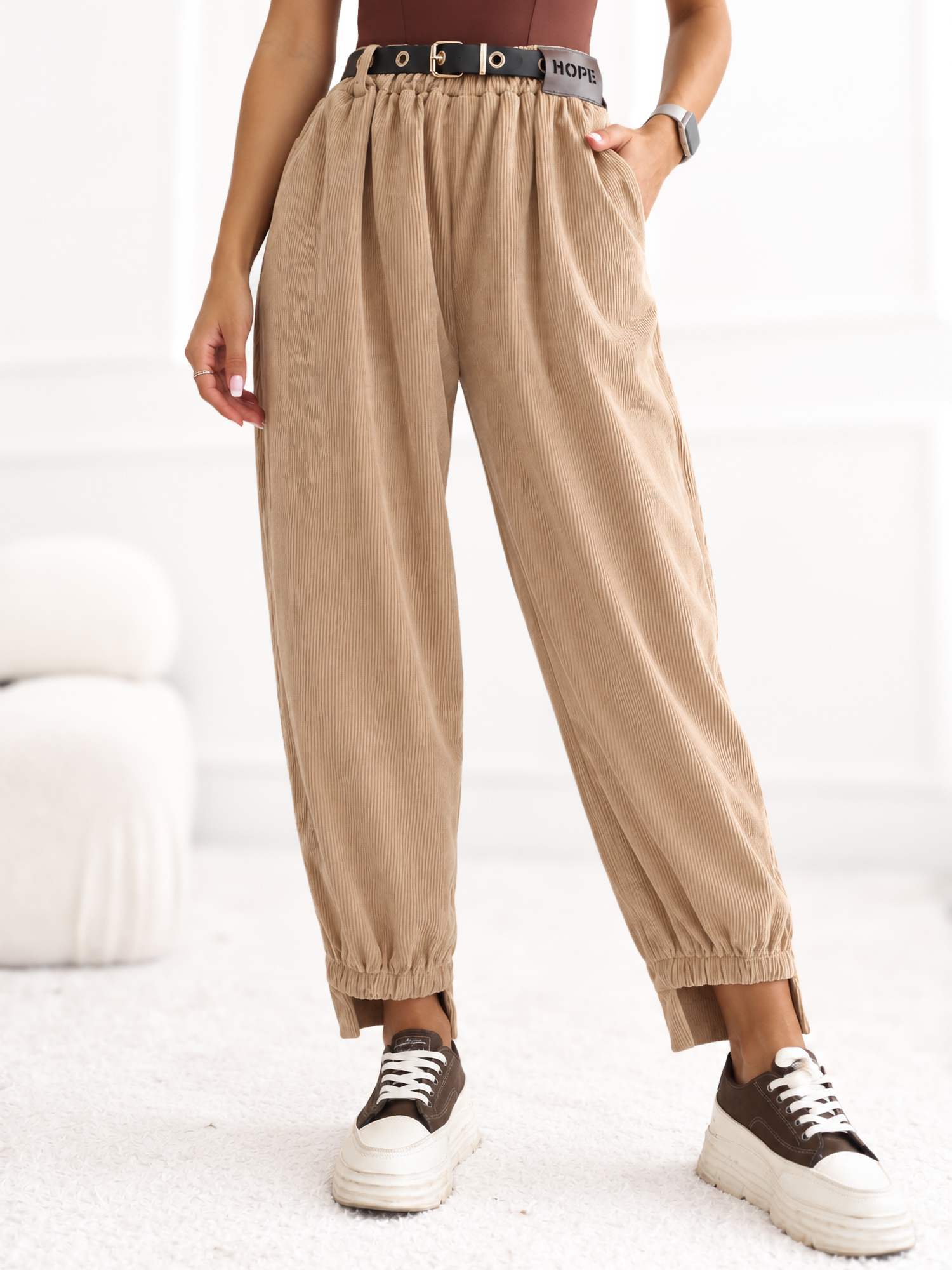RUE PARIS Camel corduroy pants with an asymmetric leg.