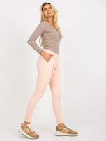 Hurtownia Brzoskwiniowe spodnie dresowe baggy z suwakiem