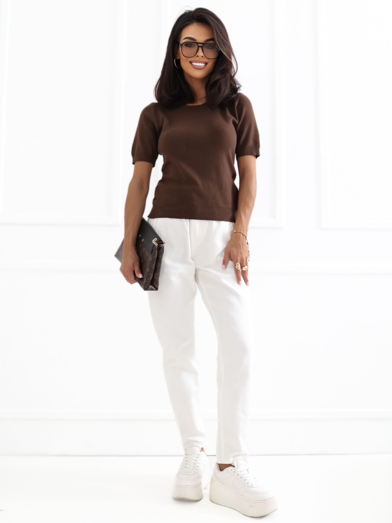 Brown women's sweater with a round neckline.