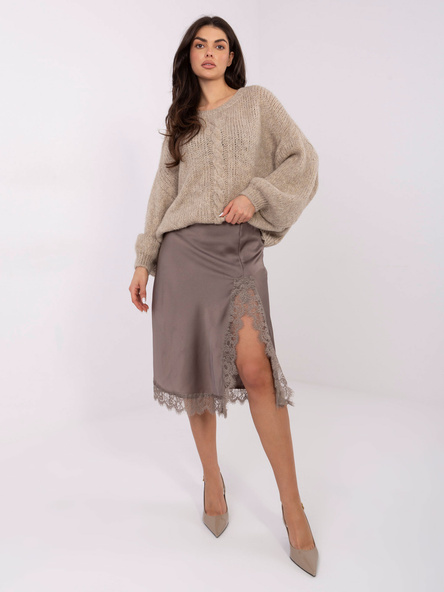 Beige oversized sweater in a solid color.