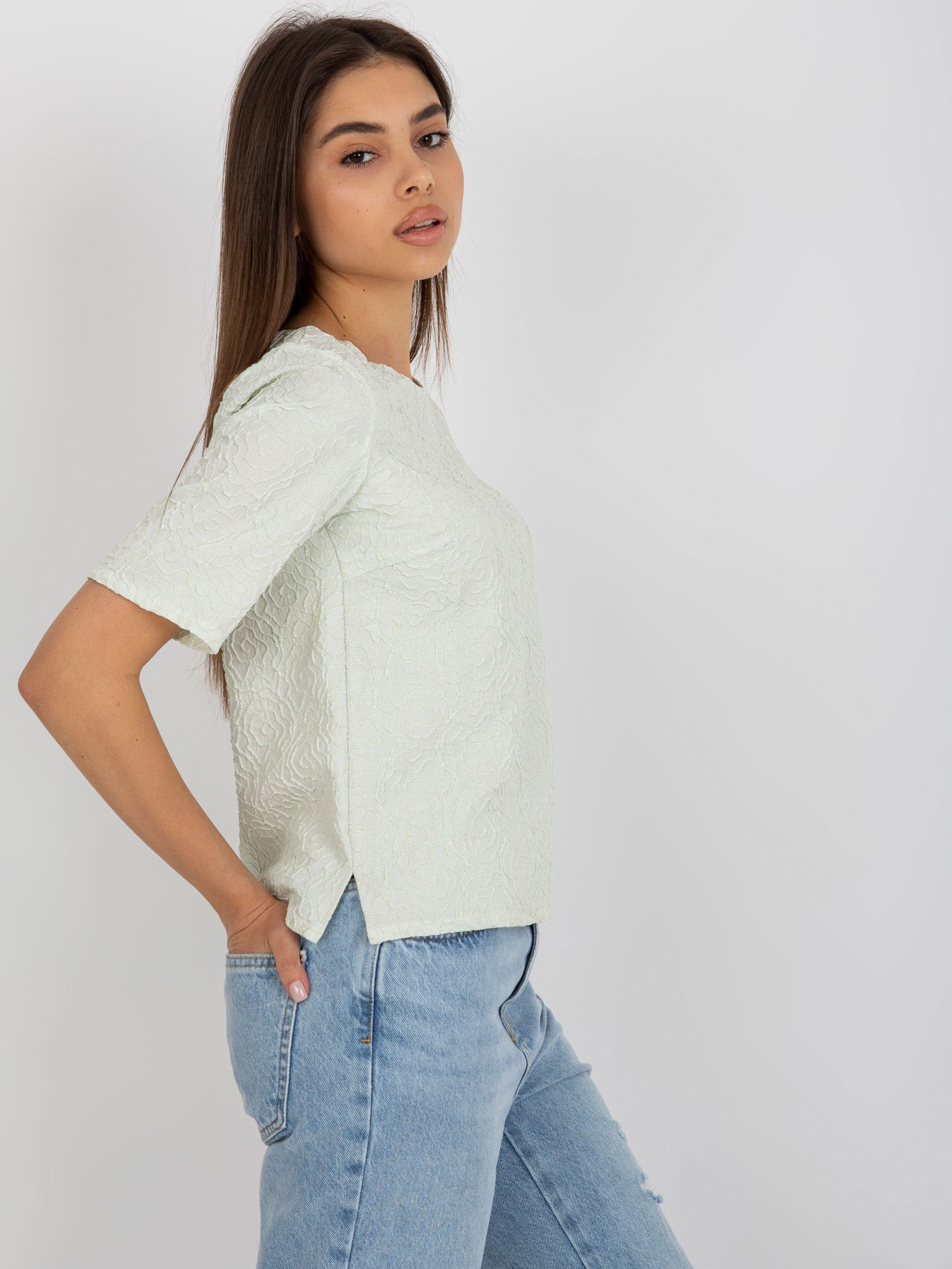 Hurt Light green blouse for special occasions with a round neckline.