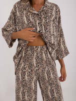 Beige-black two-piece set in animal pattern.