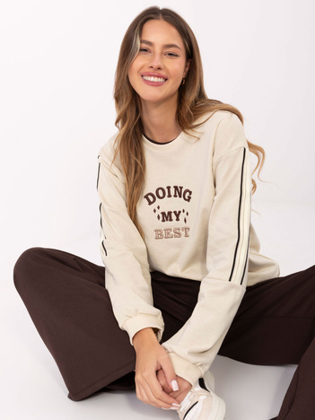 Jasnobeżowa bluza oversize z naszywką