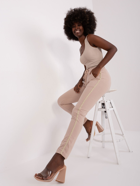 Hurt Beżowe damskie spodnie dresowe z lampasami