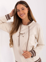 Light beige sweat hoodie with a print.