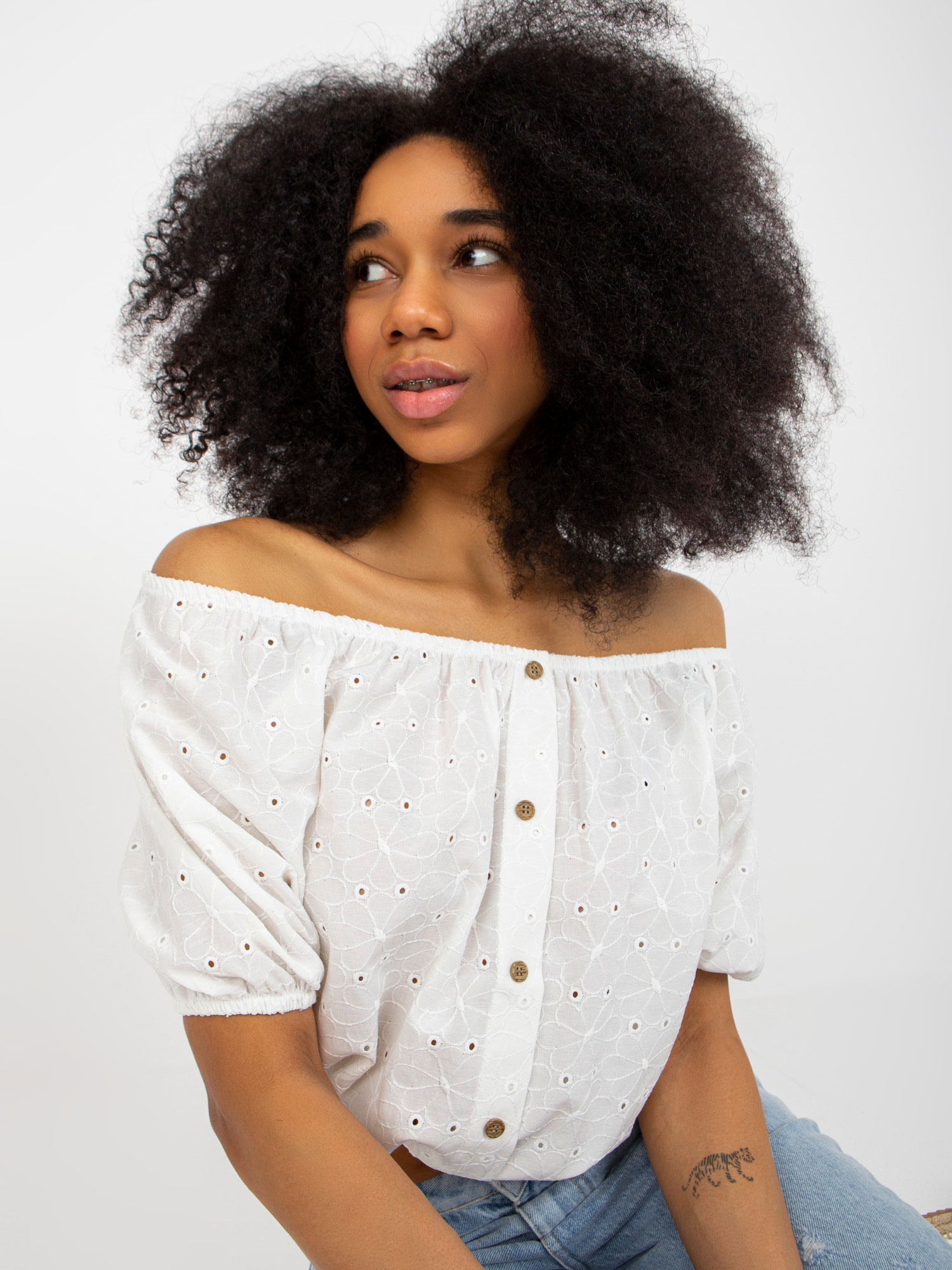 Ecru wholesale hollow blouse off-the-shoulder with buttons.