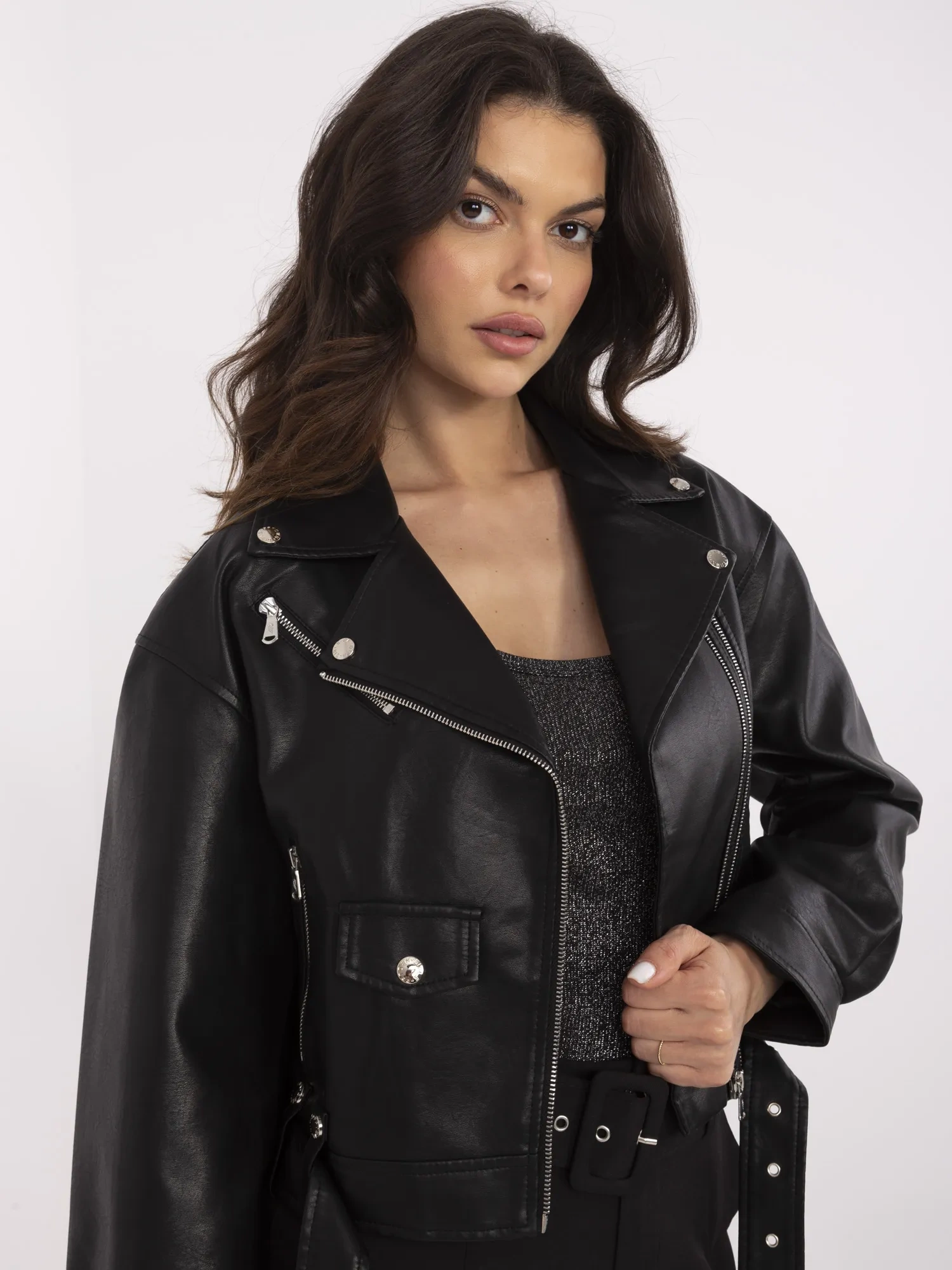 Black women's biker jacket with a belt.