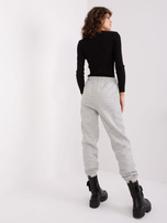Light gray sweatpants with SUBLEVEL print.
