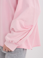 Jasně růžová bavlněná oversized košile.