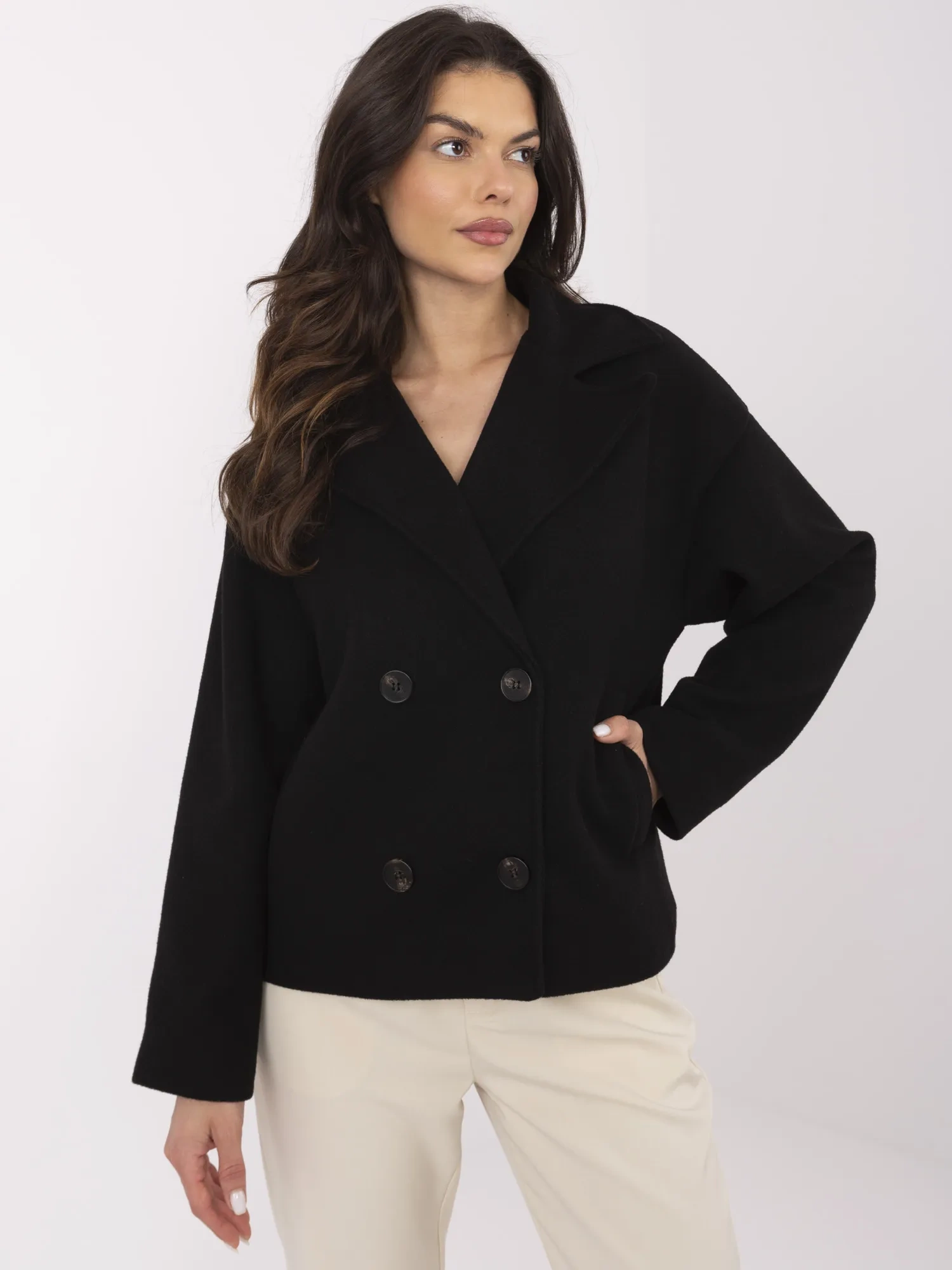 Black short coat with double-breasted fastening.