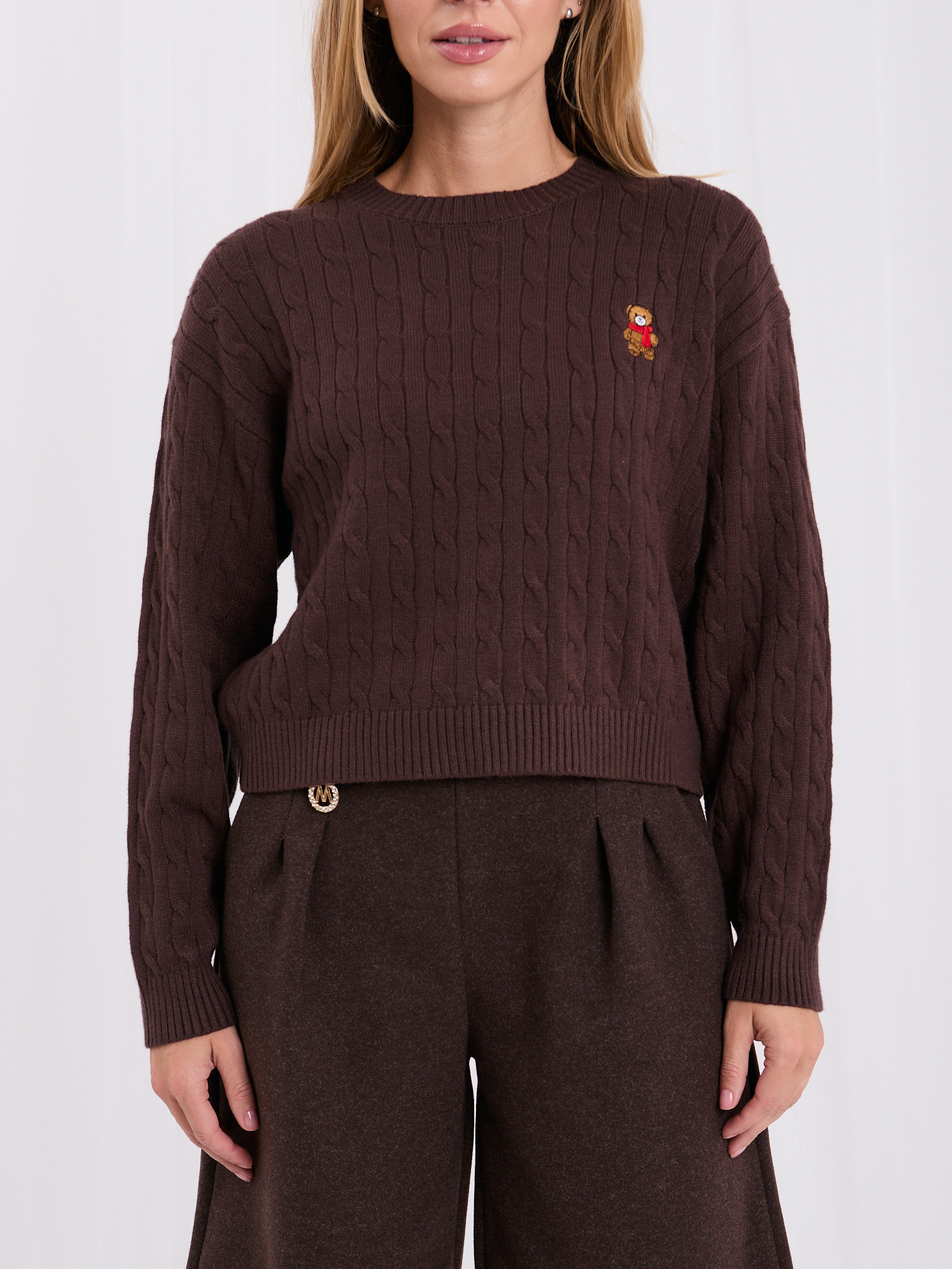 Brown classic sweater with braids.