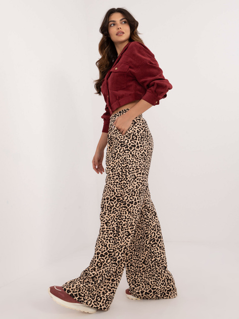 Hurtownia Beżowo-czarne długie spodnie w panterkę