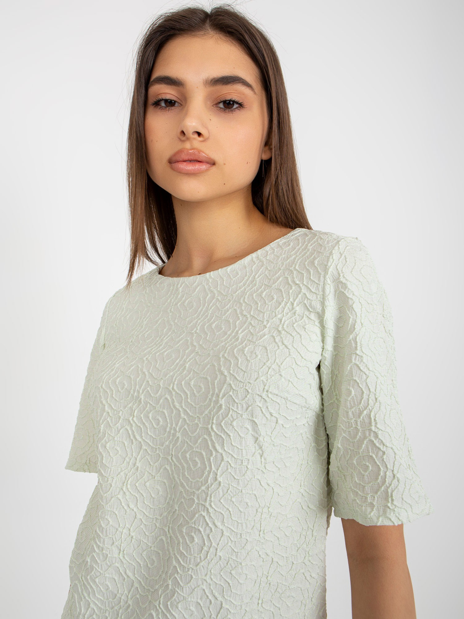 Hurt Light green blouse for special occasions with a round neckline.