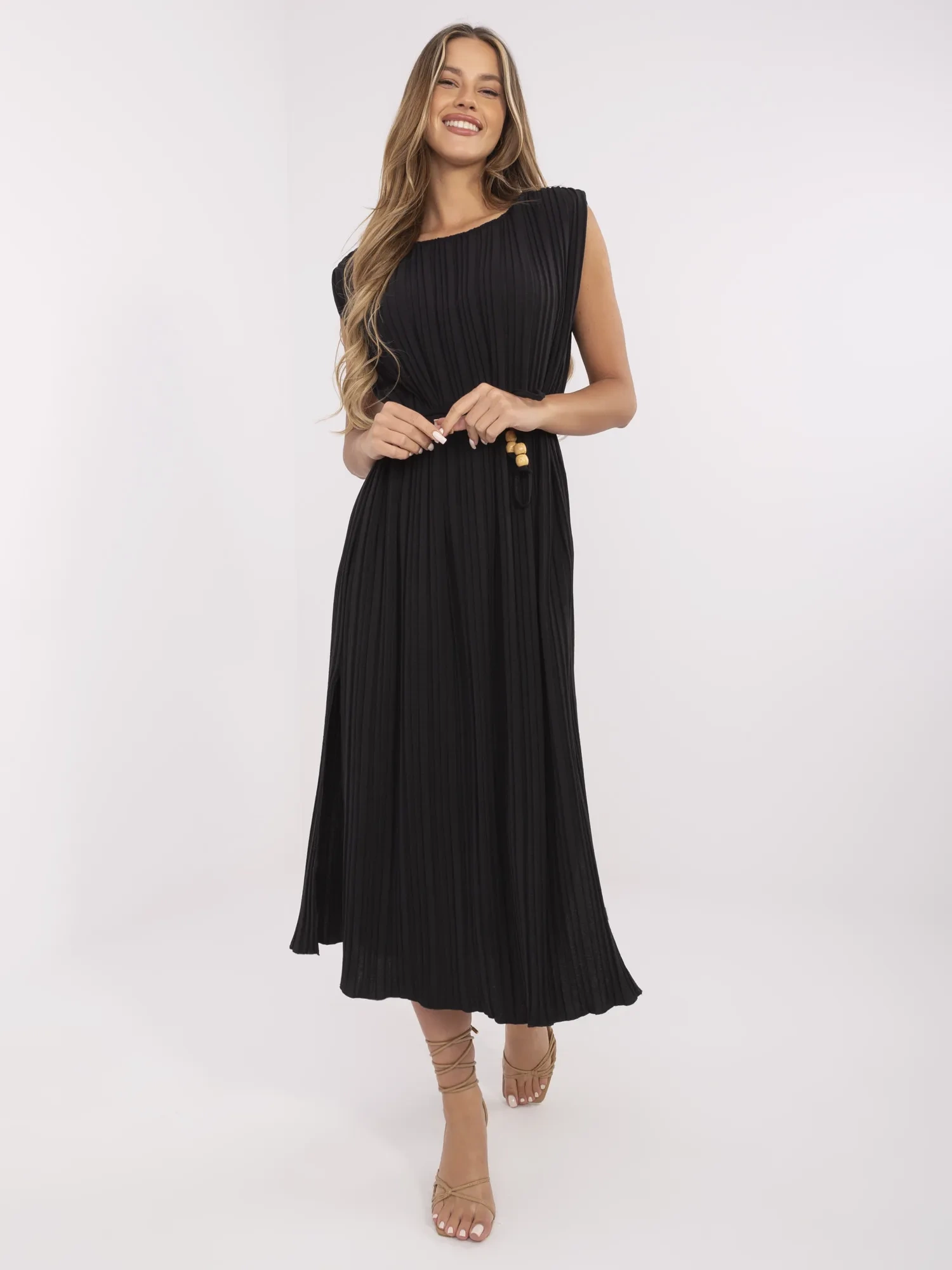Black summer dress with shoulder pads.