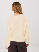 Light beige oversized sweater with wide stripes.