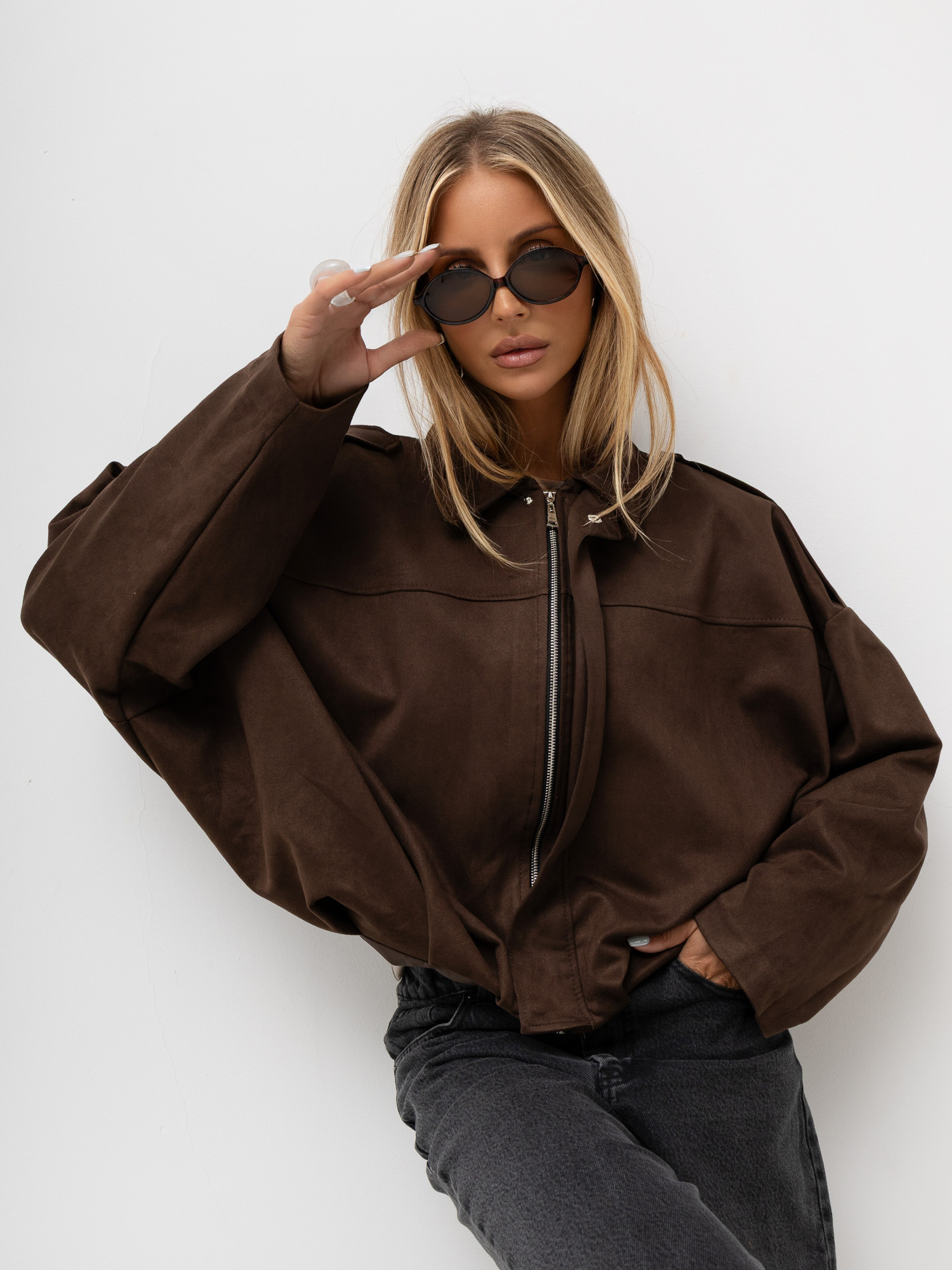 Brown women's suede-like jacket with a zipper.